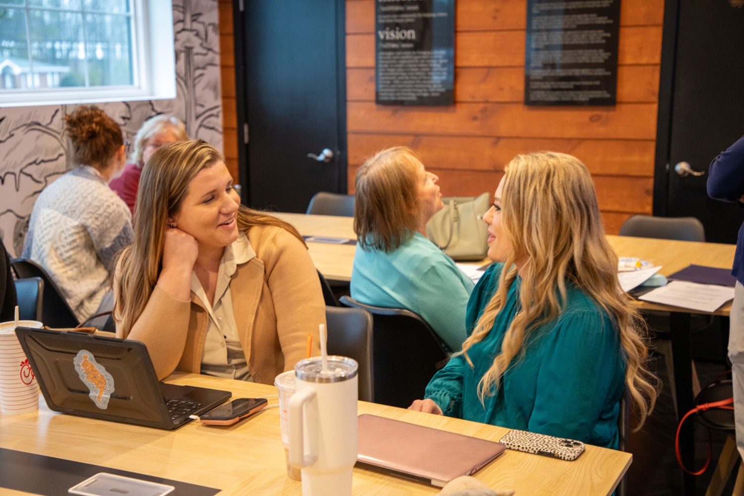 Two team members in conversation during a meeting