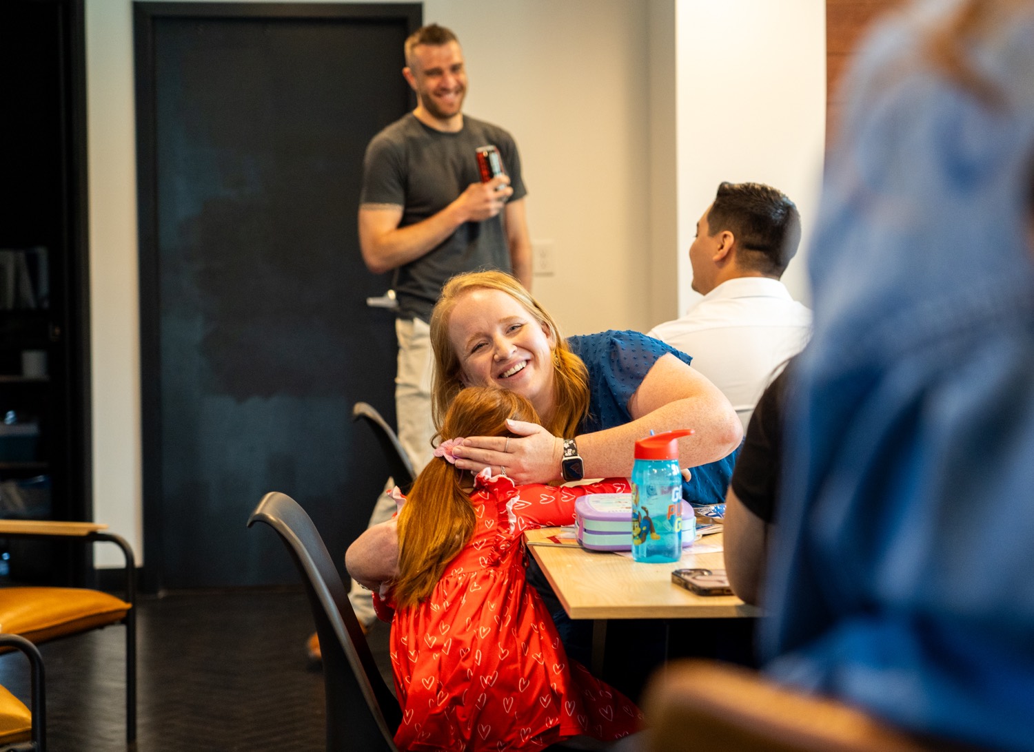 A warm moment between teammates at the office